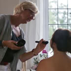 Close-up of diverse colleagues working together on a laptop in a modern office environment.